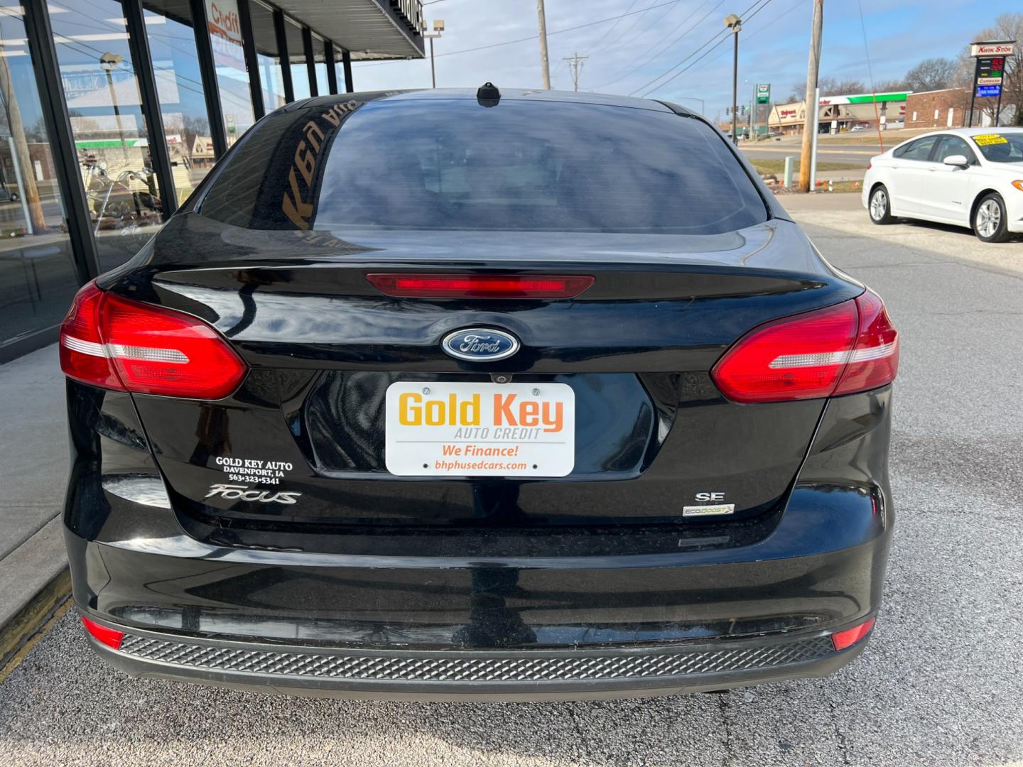 2018 Shadow Black Ford Focus SE Sedan (1FADP3FE7JL) with an 1.0L L3 engine, located at 1633 W Kimberly, Davenport, IA, 52806, (563) 323-5341, 41.559456, -90.598732 - Photo#4
